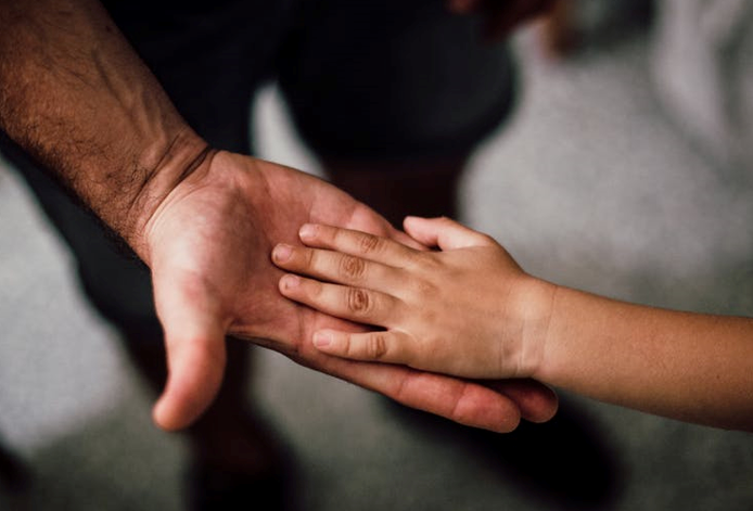 father son hands pexels